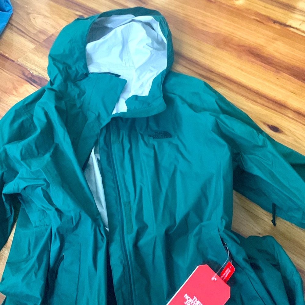 XXL NWT Green rain jacket. Brand new.